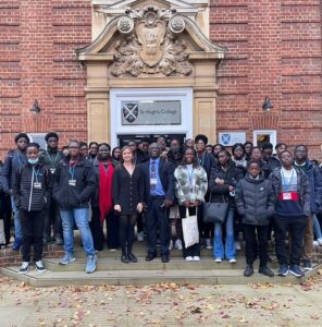 Kingsgen pupils and CEO with Outreach Manager outside St Hugh's during visit to Oxford