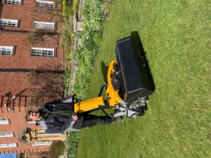 Gardner, Steve Hobson with electric cylinder mower