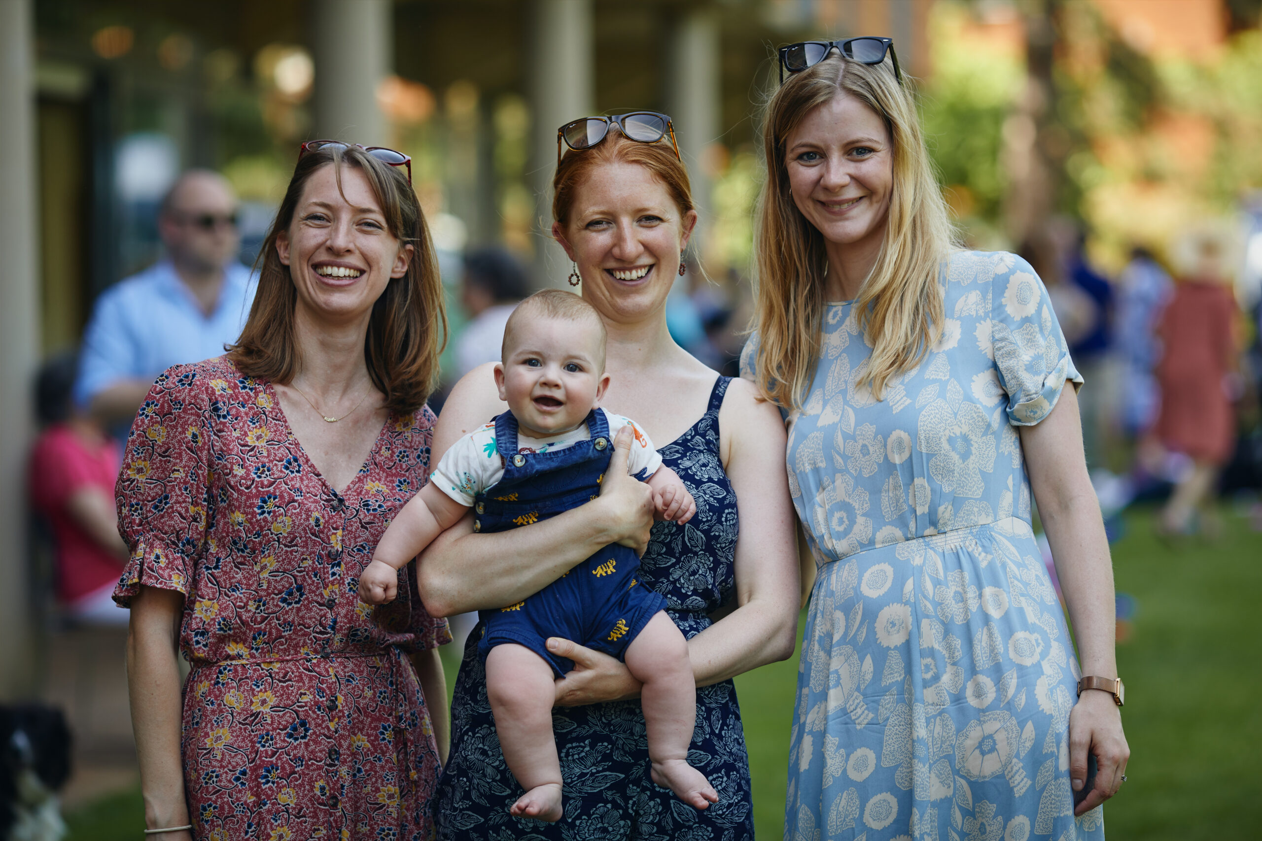 Guests with baby at summer party