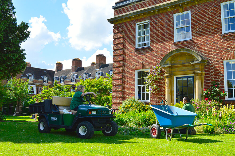 Gardeners outside Main Building